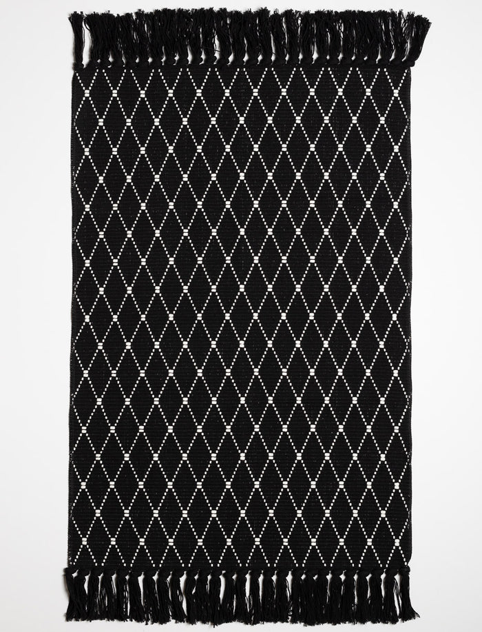 Tapis à motifs avec franges
