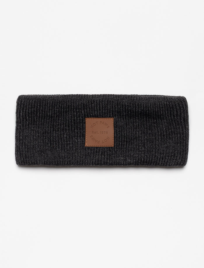 Bandeau tricoté avec écusson en cuir