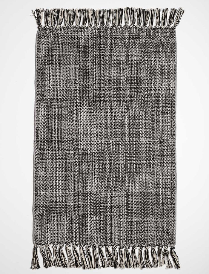 Tapis tissé à franges