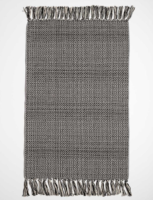 Tapis tissé à franges